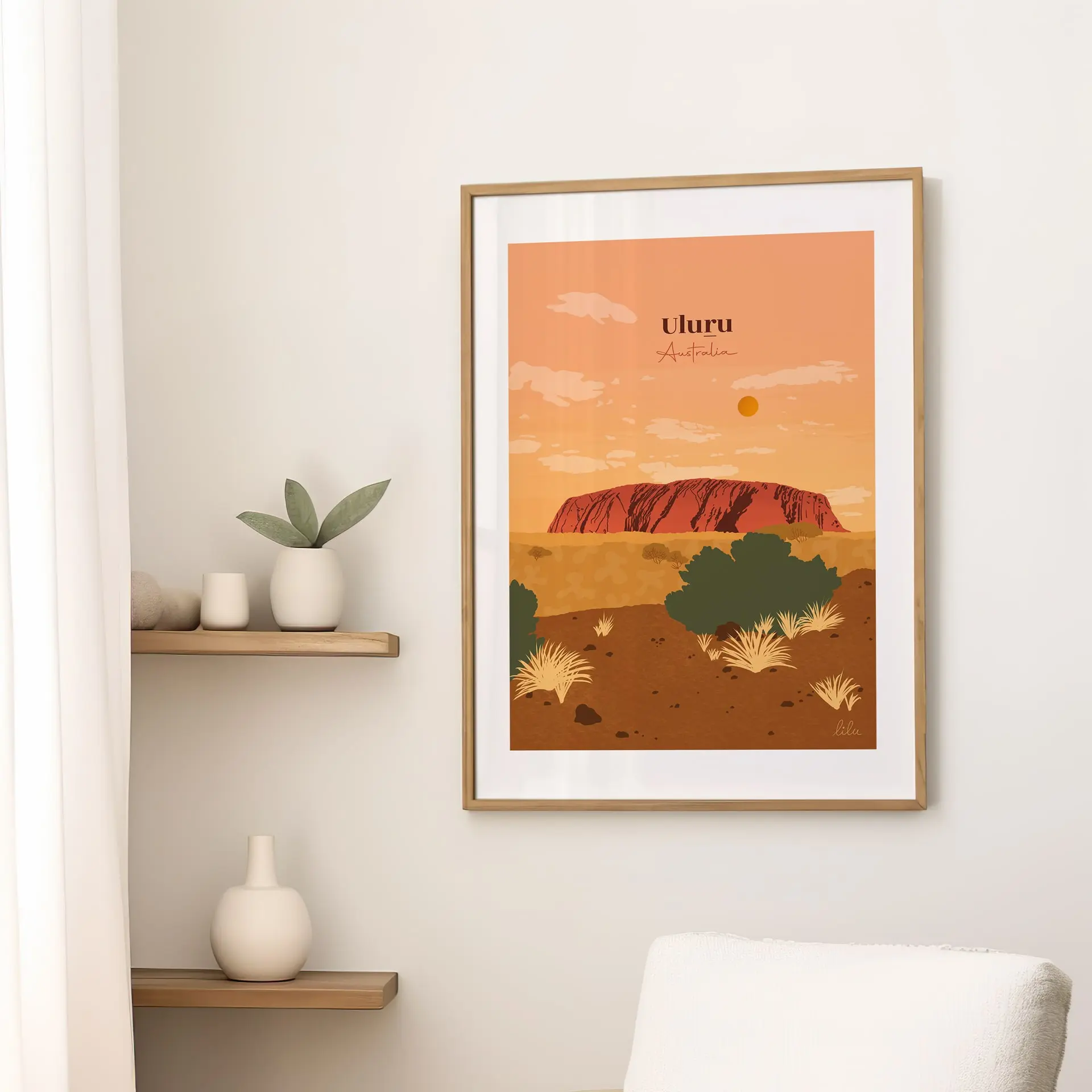 illustration-decoration-uluru-australie Une affiche sur un mur dans le salon illustrant l'immense roger rouge d'Uluru au milieu du désert australien