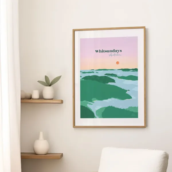Une affiche sur un mur dans le salon illustrant les îles et l'eau turquoise de l'archipel des Whitsundays