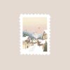 Un sticker de Noël représentant un village de Noël en forme de timbre